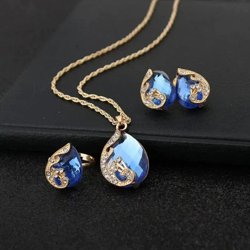 Set de collar y pendientes en cristal azul con montura de oro